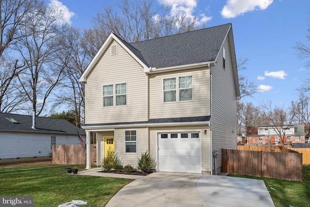 view of front of house featuring a garage and a front yard