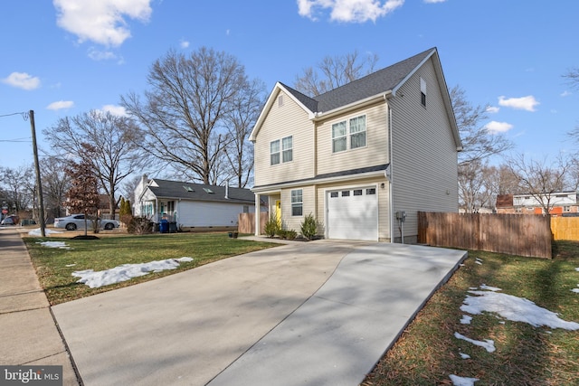 view of front of house featuring a garage and a front yard