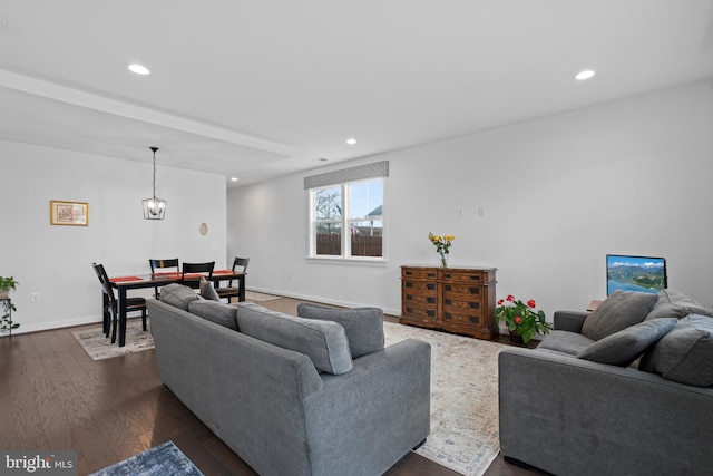 living room featuring dark hardwood / wood-style floors