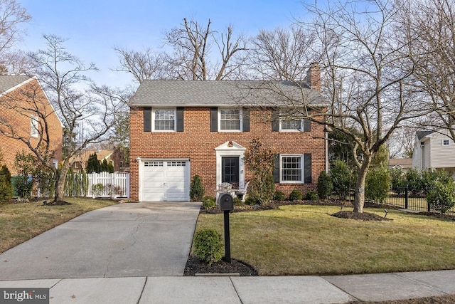 view of front of home with a garage and a front lawn