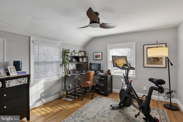 office space featuring vaulted ceiling, ceiling fan, and light hardwood / wood-style floors