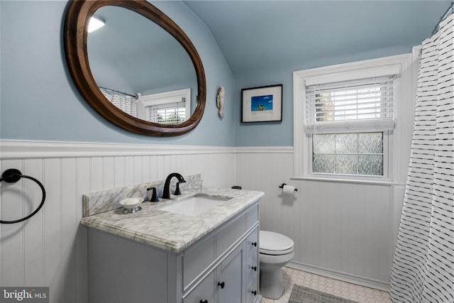 bathroom with vanity, tile patterned flooring, and toilet