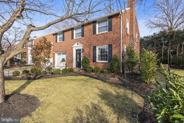 view of front of home featuring a garage and a front lawn