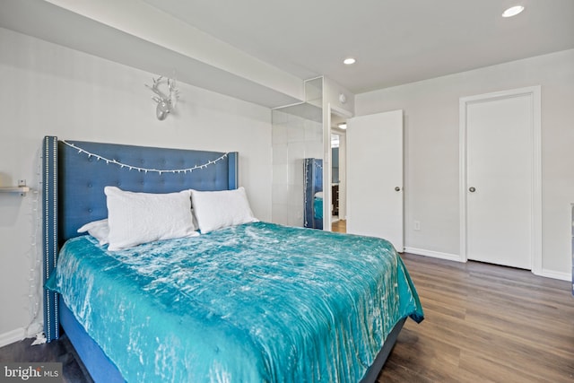 bedroom featuring dark wood-type flooring