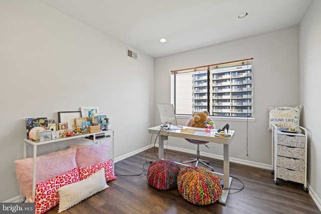 office space with dark hardwood / wood-style flooring