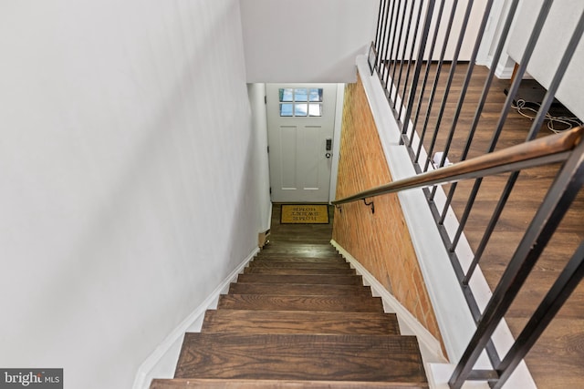 staircase with wood-type flooring