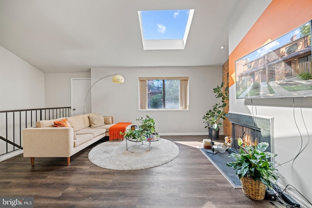 living room with dark hardwood / wood-style floors and lofted ceiling with skylight