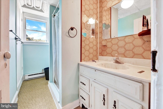 bathroom with a baseboard radiator and vanity