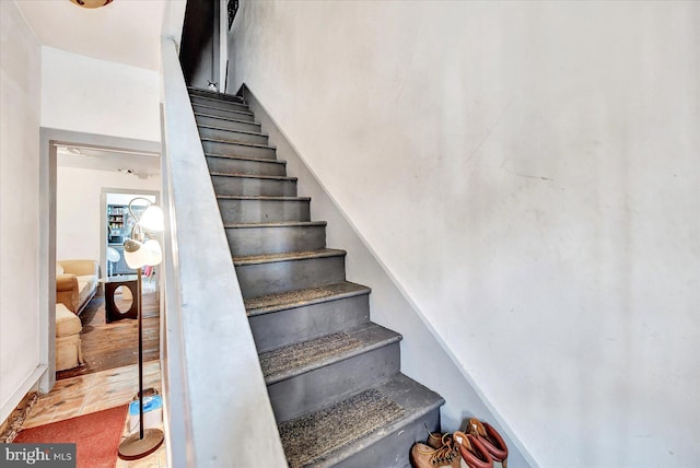 stairway featuring tile patterned floors