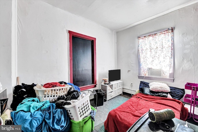 bedroom featuring a baseboard radiator and cooling unit