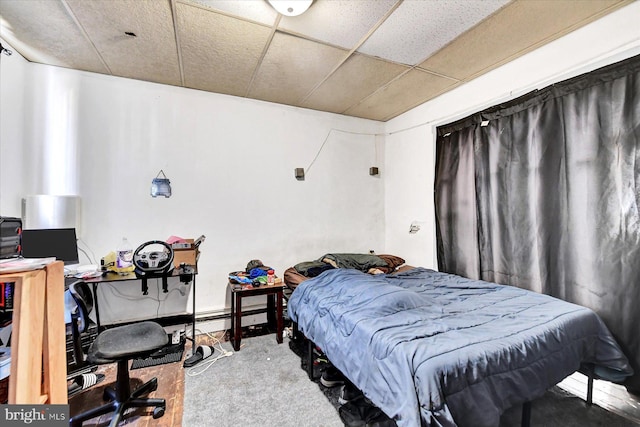 bedroom featuring a drop ceiling