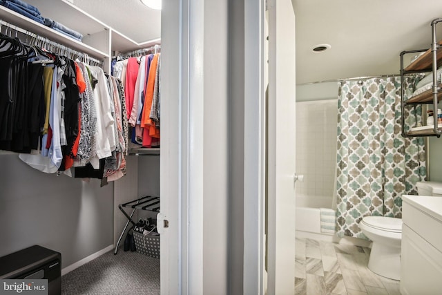 full bathroom featuring toilet, vanity, and shower / bath combo with shower curtain