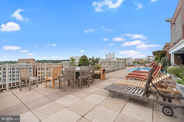 view of patio with a fenced in pool