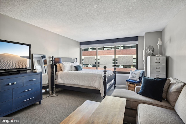 bedroom with carpet flooring and a textured ceiling