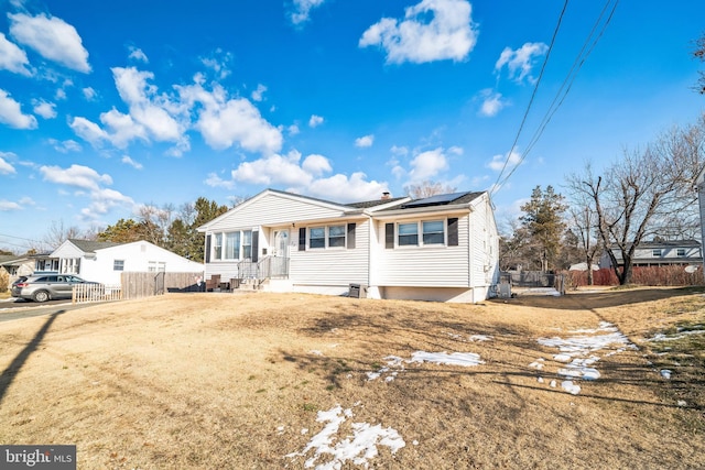 view of front of home featuring solar panels