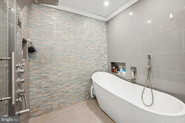 bathroom with tile walls, ornamental molding, and independent shower and bath