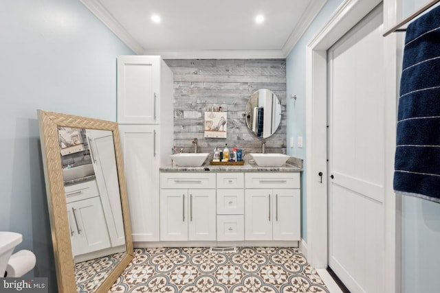 bathroom with vanity, tile patterned flooring, wooden walls, and ornamental molding