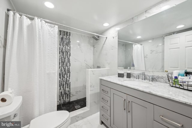 bathroom with vanity, toilet, and a shower with shower curtain