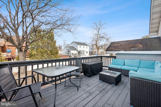 wooden deck featuring an outdoor living space