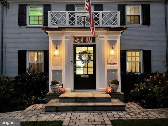 entrance to property with a balcony