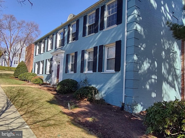 view of home's exterior featuring a yard