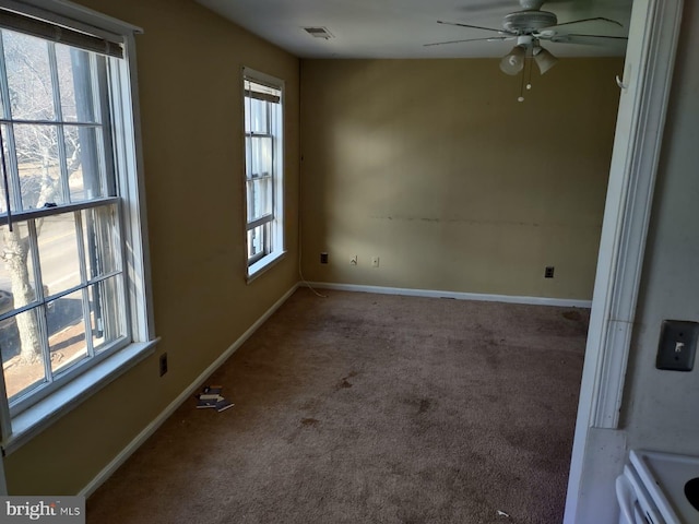 empty room with carpet flooring and ceiling fan