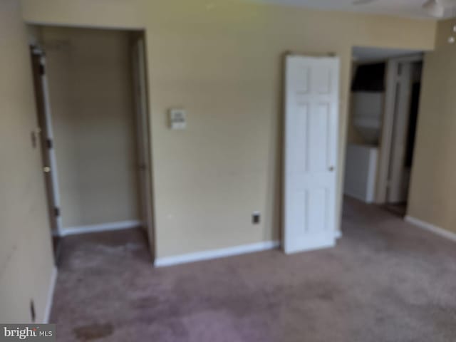 unfurnished bedroom with carpet floors