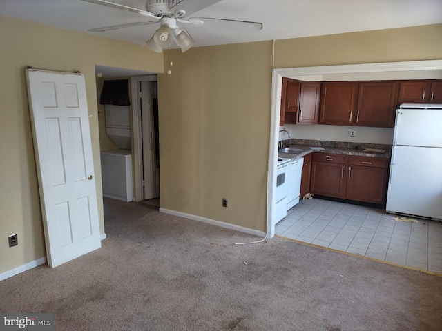 kitchen with ceiling fan, sink, light carpet, and white appliances