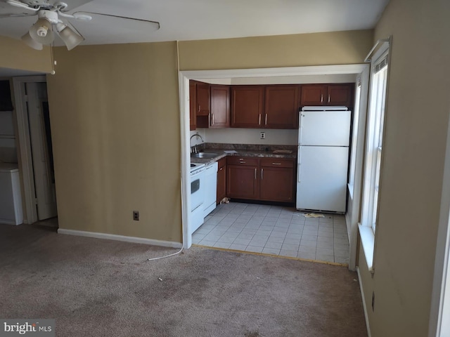 kitchen with ceiling fan, sink, light colored carpet, and white appliances