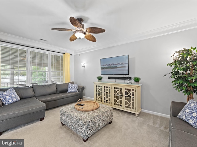 carpeted living room featuring crown molding and ceiling fan