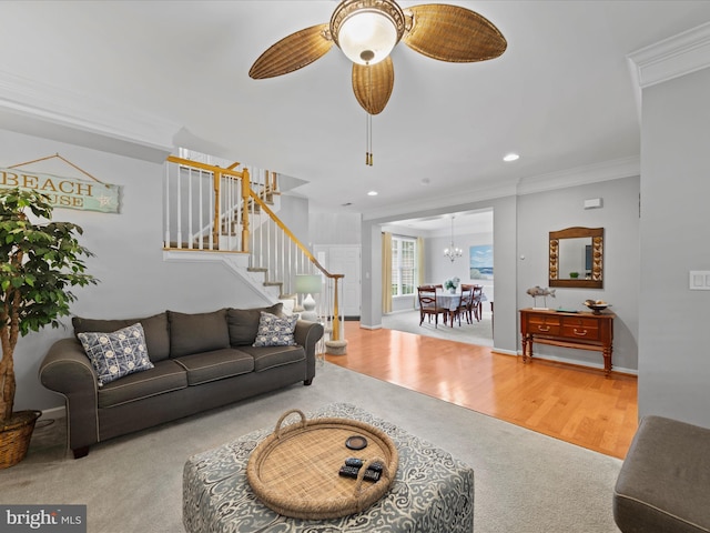 living room featuring crown molding, ceiling fan, and wood-type flooring