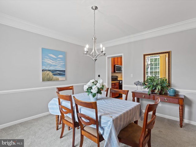 dining space with light carpet, ornamental molding, and an inviting chandelier