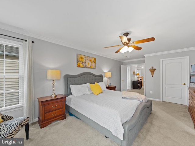 carpeted bedroom featuring ceiling fan, ornamental molding, and multiple windows