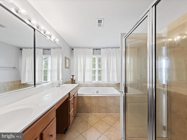 bathroom with vanity, tile patterned floors, and independent shower and bath