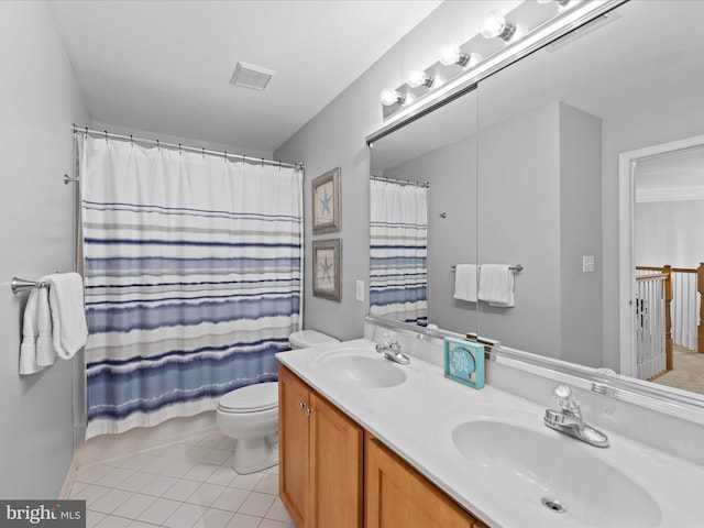 bathroom featuring a shower with shower curtain, vanity, toilet, and tile patterned flooring