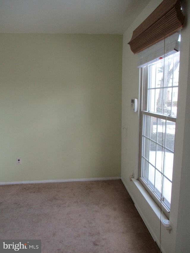 unfurnished room featuring carpet flooring