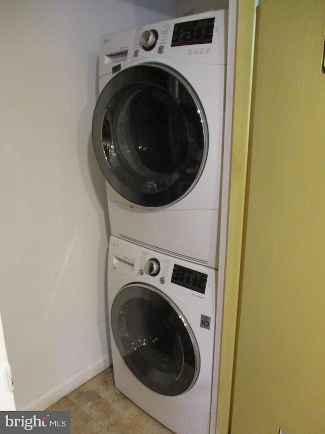 laundry area featuring stacked washer and dryer