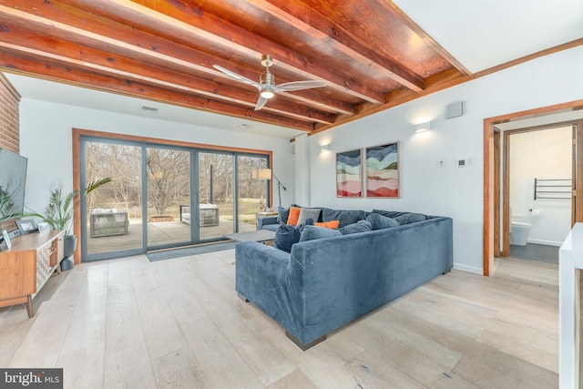 living room featuring beamed ceiling, ceiling fan, and light hardwood / wood-style floors