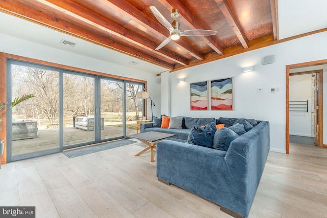 living room featuring ceiling fan, beamed ceiling, and light wood-type flooring