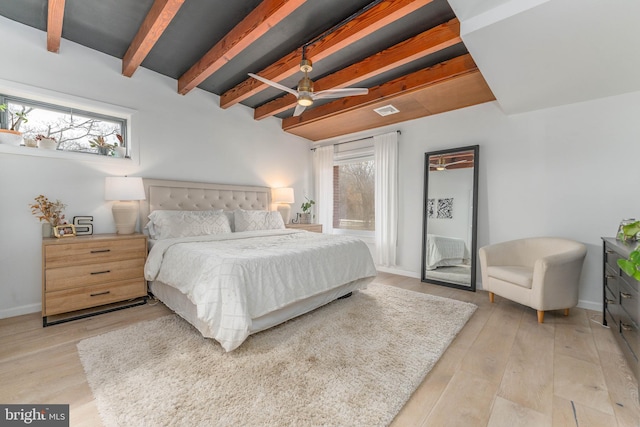 bedroom with ceiling fan, beam ceiling, and light hardwood / wood-style flooring