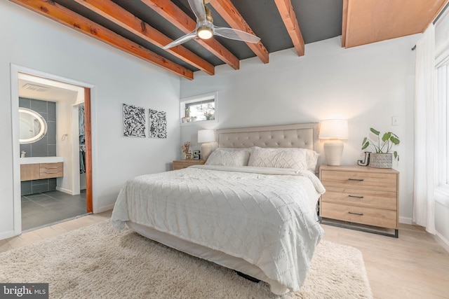 bedroom with beamed ceiling and ensuite bathroom