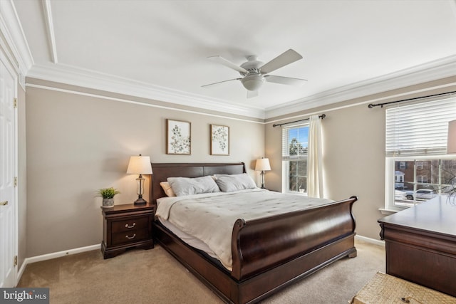 bedroom featuring crown molding, light colored carpet, and ceiling fan