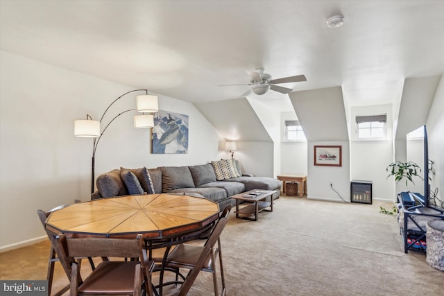 carpeted living room featuring vaulted ceiling and ceiling fan