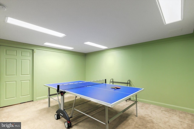 playroom with crown molding and light colored carpet