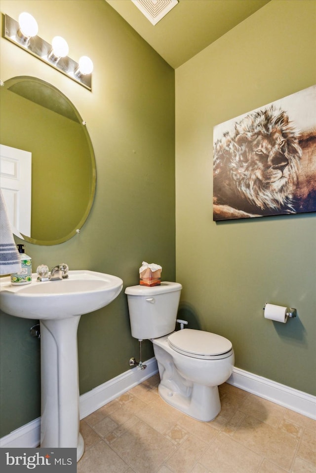 bathroom with toilet and sink