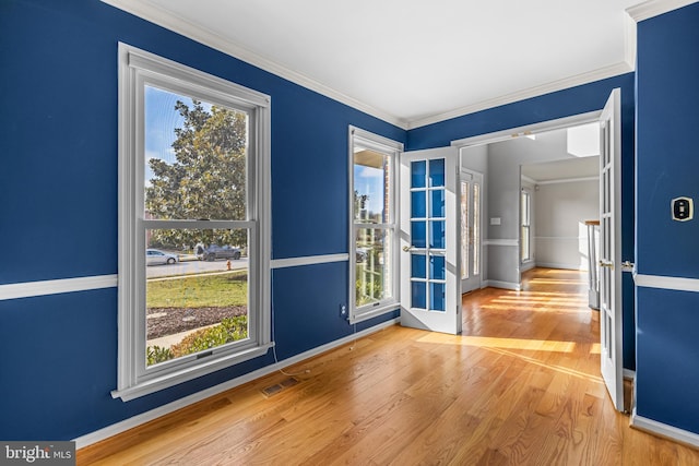 doorway featuring hardwood / wood-style flooring and ornamental molding