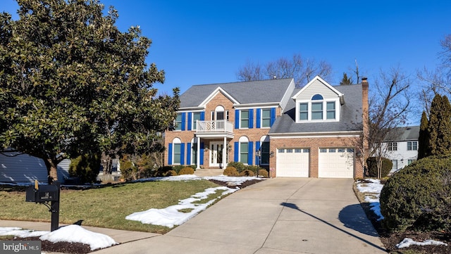 view of front facade featuring a garage and a front lawn