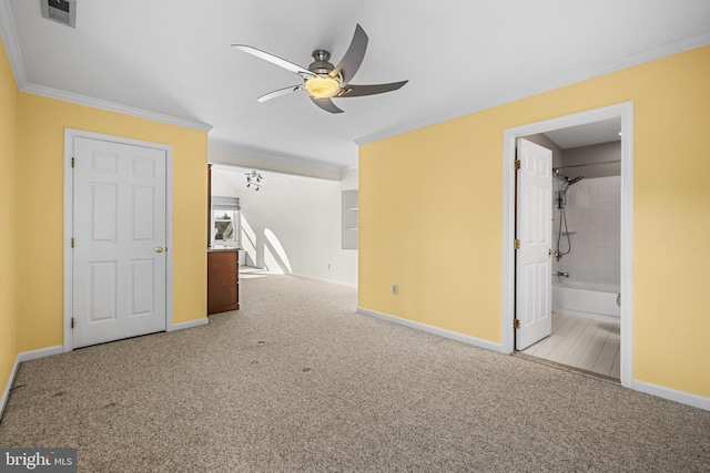 unfurnished bedroom with crown molding, light colored carpet, and connected bathroom