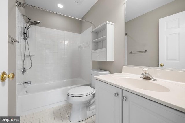 full bathroom featuring tiled shower / bath, vanity, toilet, and tile patterned flooring