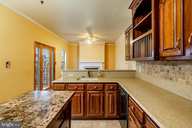 kitchen with sink, crown molding, dishwasher, ceiling fan, and tasteful backsplash